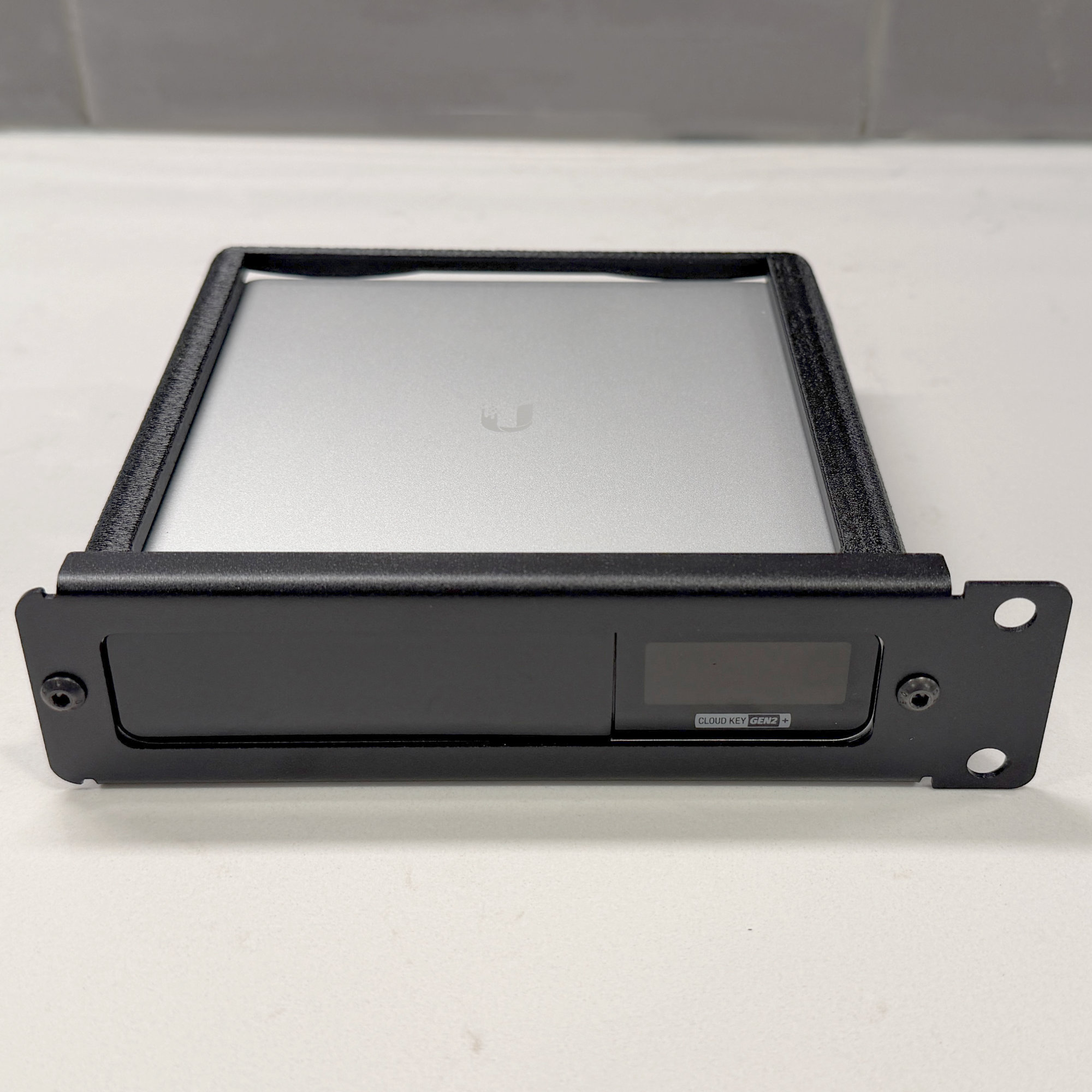 A picture of the assembled unit with a Cloud Key Gen2 Plus