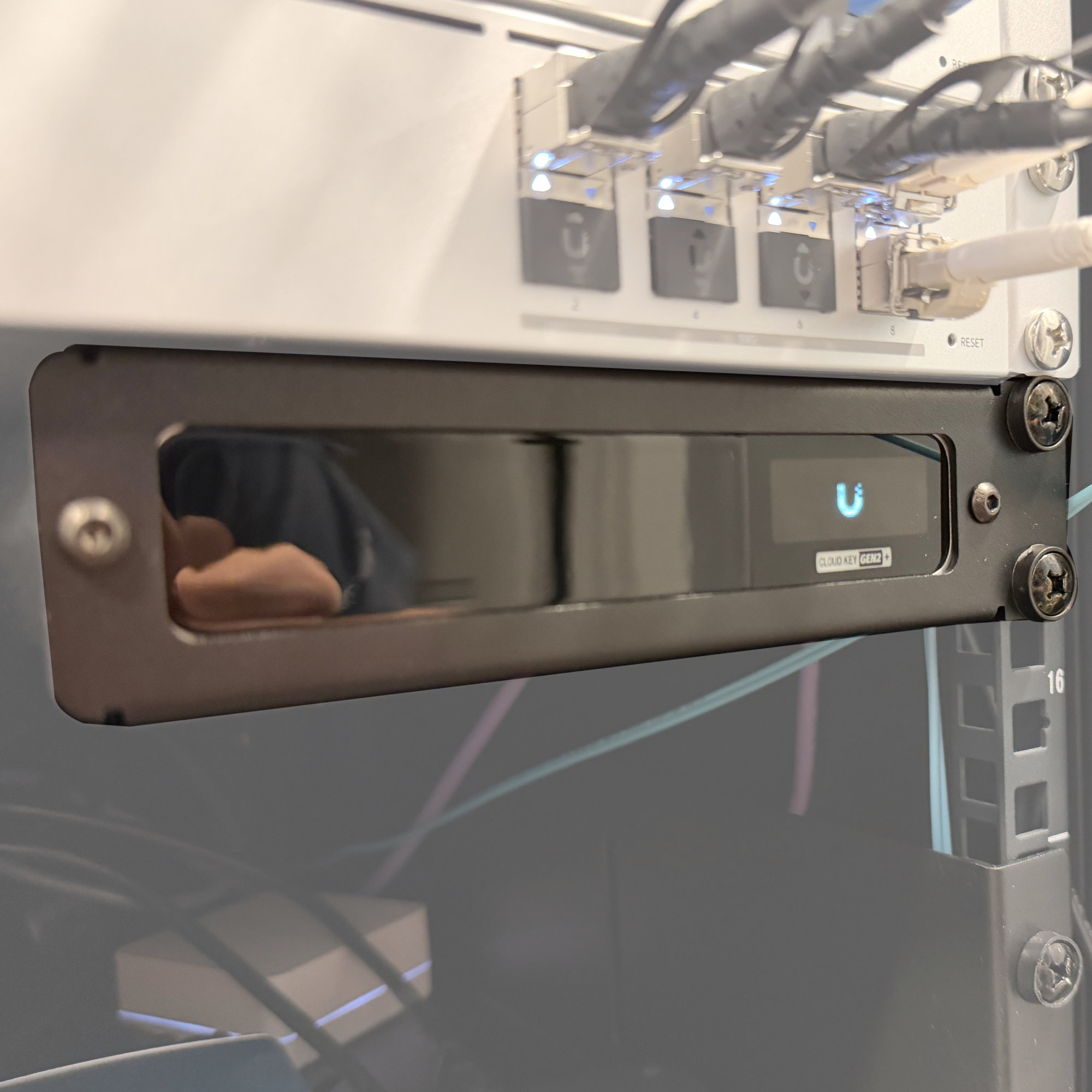 Unit installed in a server rack with a Cloud Key Gen2 installed and powered on